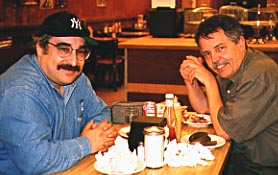 Me in my Yankee Cap, with Doc Searls, enjoying the superb deli food at Katz's, a New York Institution.  Photo by Susan.